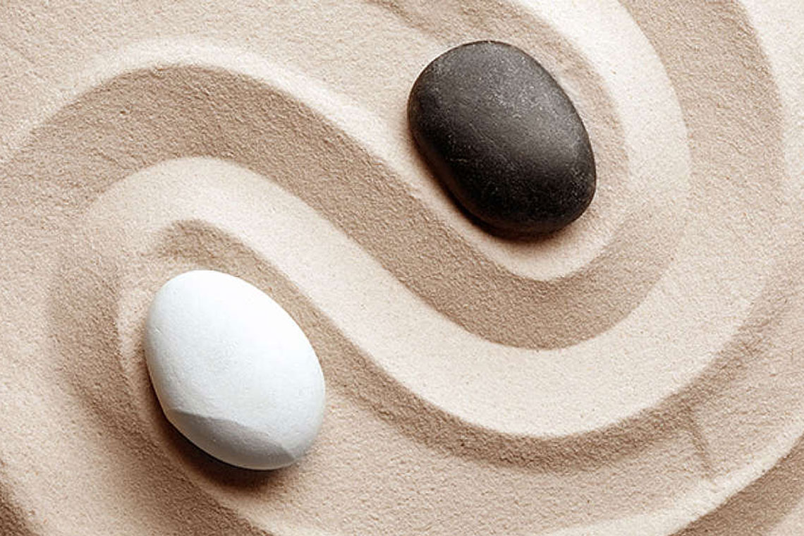 Ying und Yang in Sand